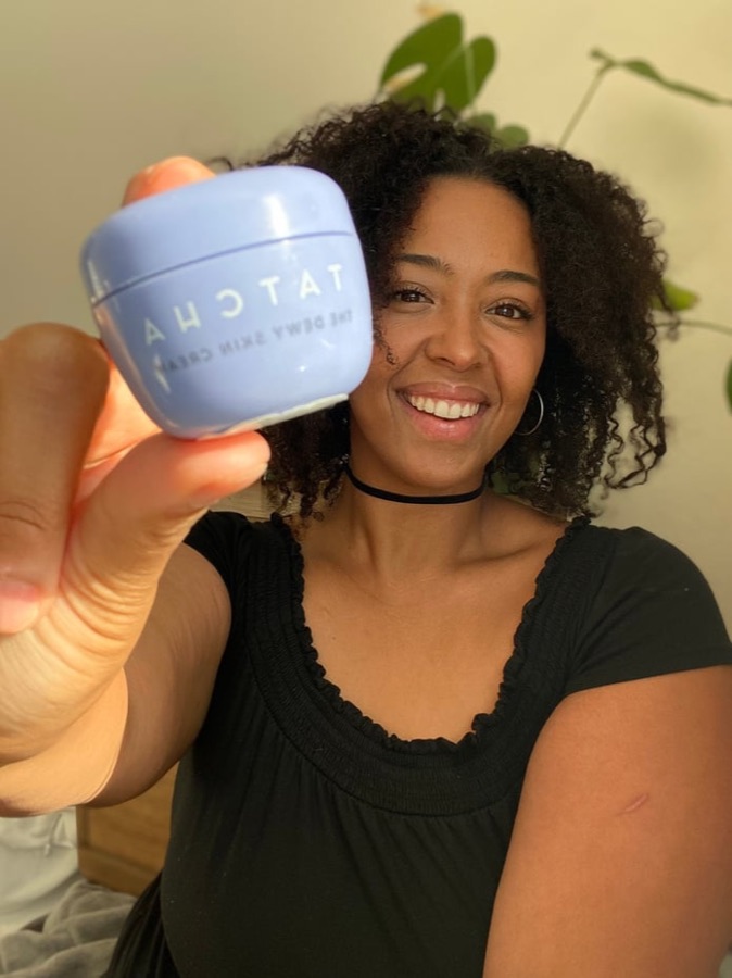 Sidney holding a Tatcha water cream jar